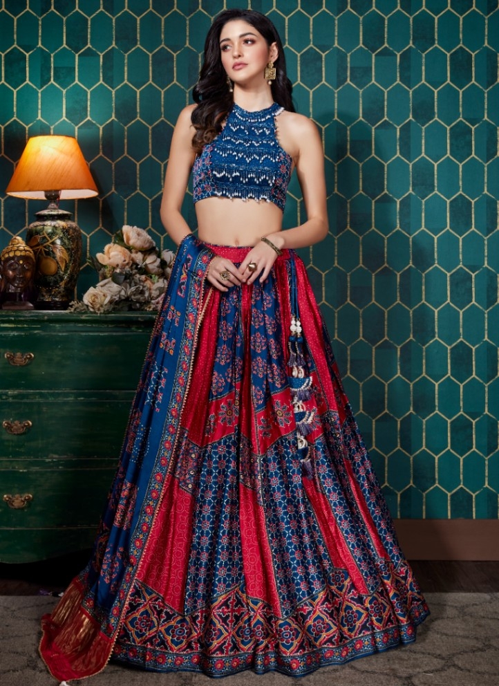 Heavily embellished midnight blue lehenga with heavy gold Zari work paired  with dull gold Zari blouse and a net red dupatta with a Zari border |  Curated by Witty Vows - Witty Vows