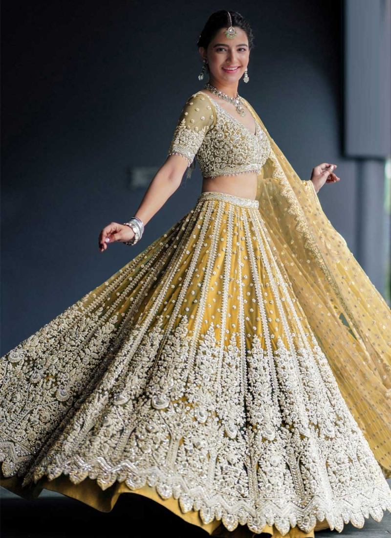 https://www.weddingsurat.com/image/cache/data/net-yellow-embroidered-lehenga-choli-19429-800x1100.jpg