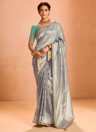 Pleasing Embroidered Tissue Grey Traditional Saree